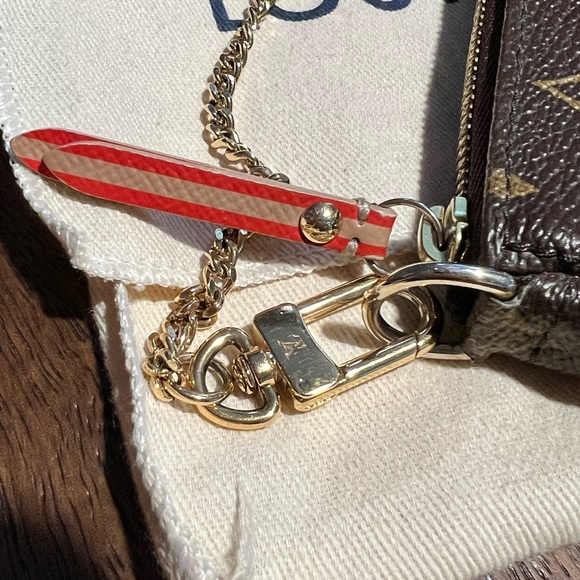 Pre-loved Louis Vuitton Limited Edition Trunks Edition Monogram Mini Pochette - Picture 2 of 10